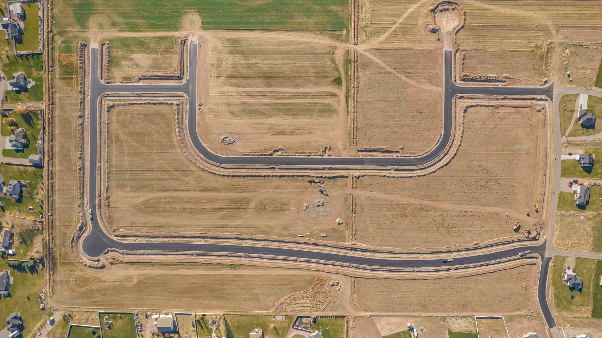 Top-down aerial showing lot layout and paved roads